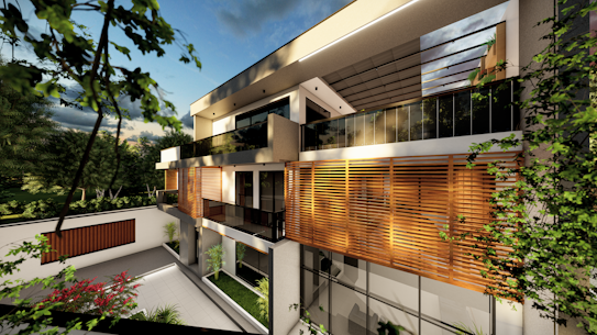 A modern, architectural house with large windows and wooden paneling on the upper floor. The building is surrounded by greenery including trees and shrubs in a well-maintained garden area. The sky is partly cloudy, and there is a warm light cast over the structure, suggesting a serene and comfortable setting.