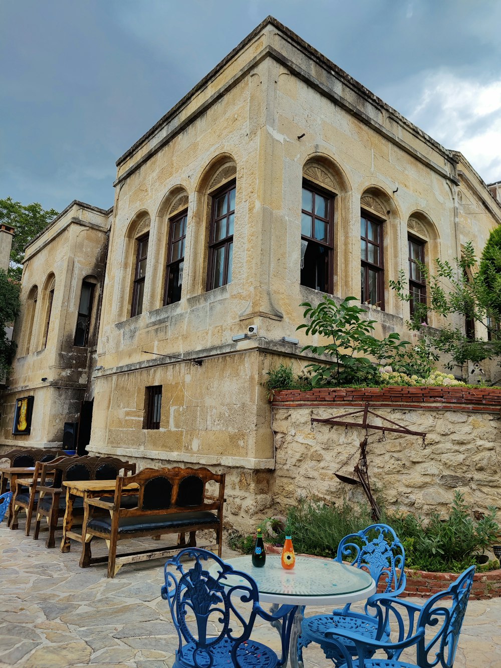 a building with tables and chairs outside