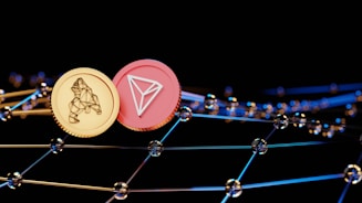 Two virtual coins, one gold with a bear symbol and another pink featuring a triangular logo, are positioned against a backdrop of interconnected digital nodes. The image conveys a futuristic and technological ambiance.