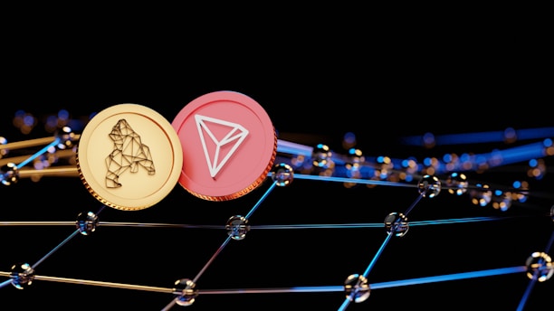 Two virtual coins, one gold with a bear symbol and another pink featuring a triangular logo, are positioned against a backdrop of interconnected digital nodes. The image conveys a futuristic and technological ambiance.