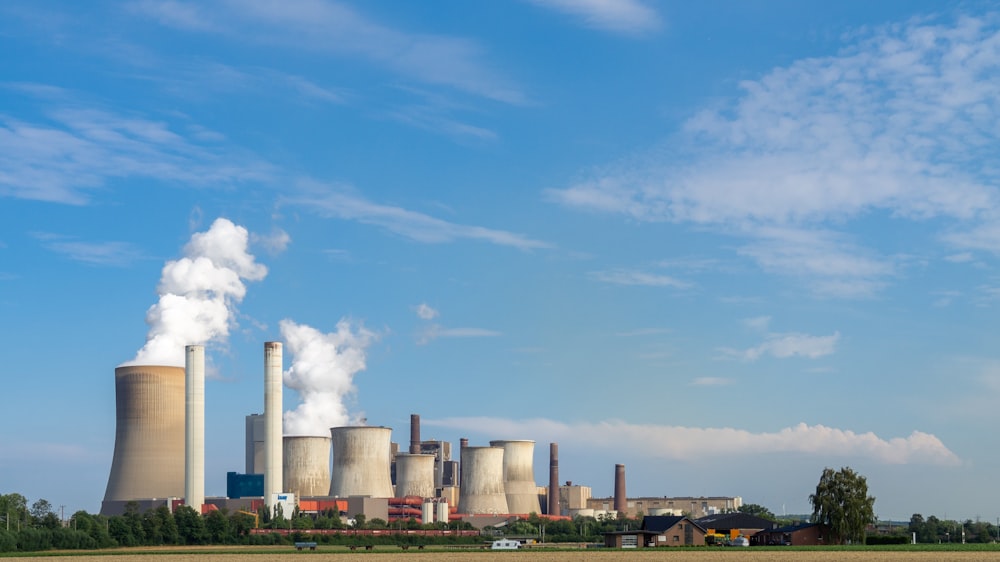 a factory with smoke stacks