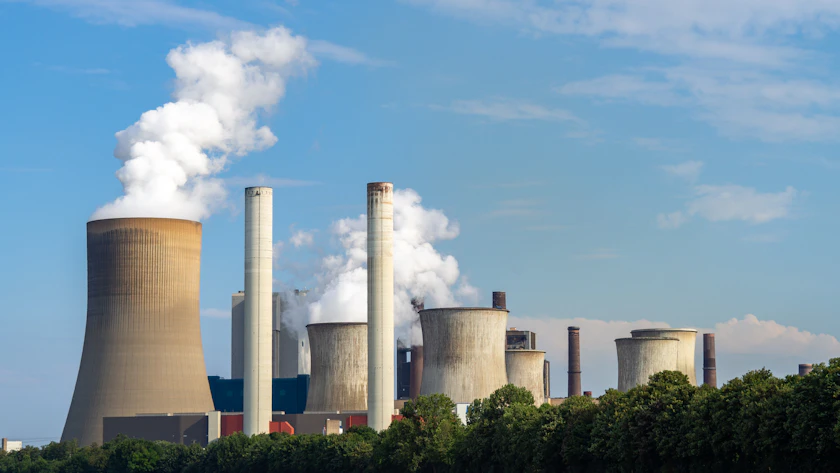 Cooling towers and smokestacks of the Niederaussem power plant in Germany.
