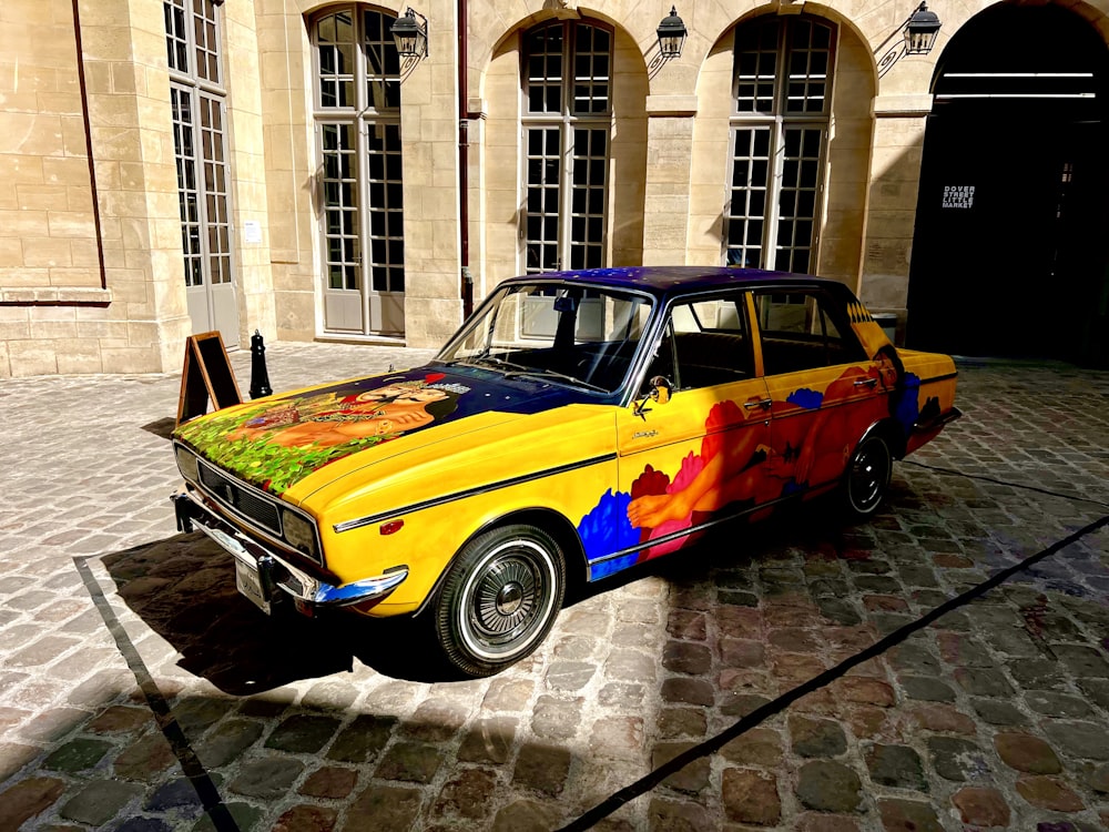 a car painted with a rainbow design