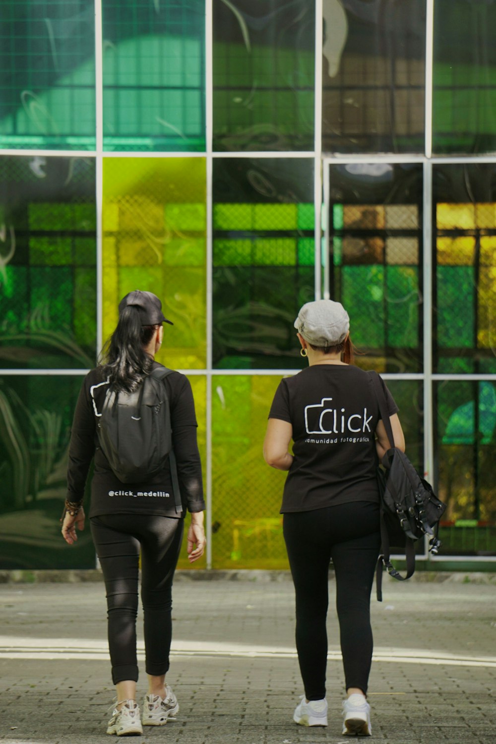 a couple of women walking