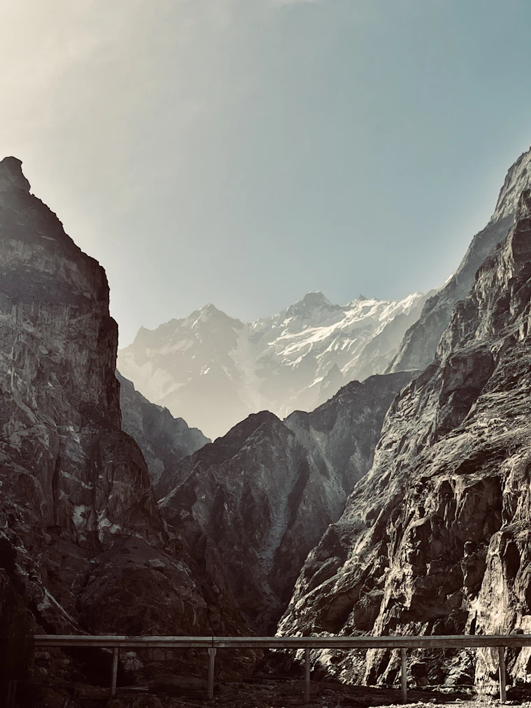 The Karakoram Highway threading a gorge below snow peaks