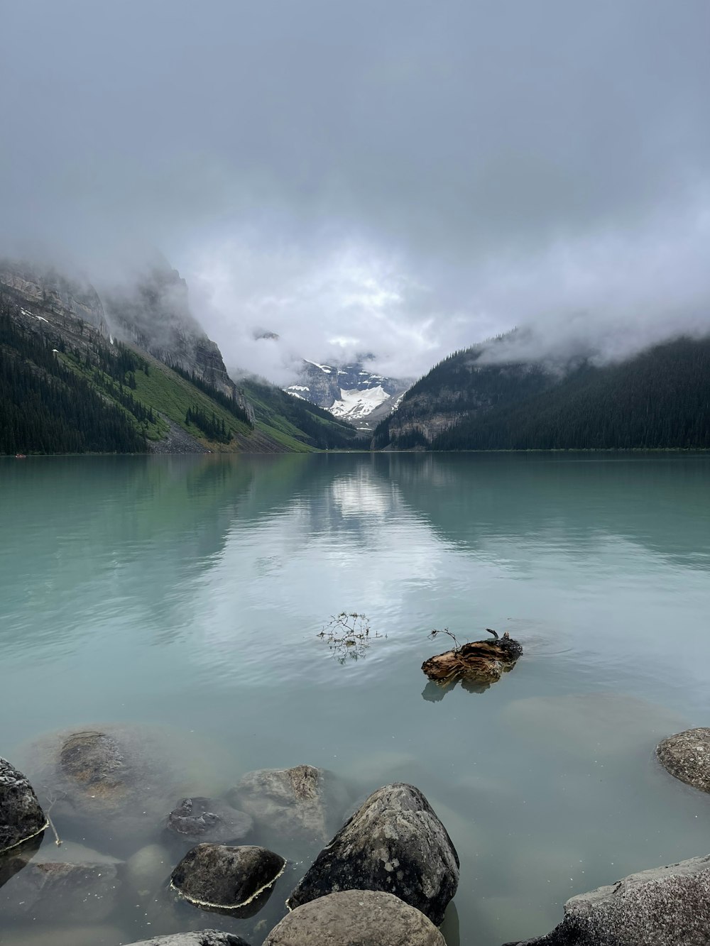 a lake with mountains in the background