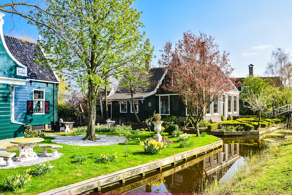 a pond with a house and trees