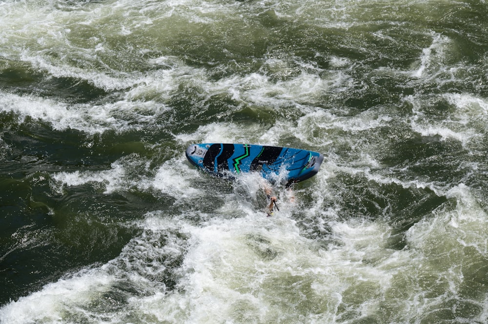 a person surfing in the sea