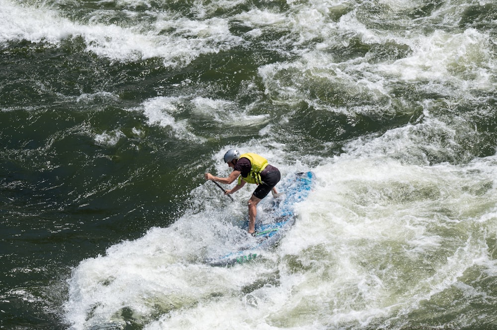 a man surfing on a wave