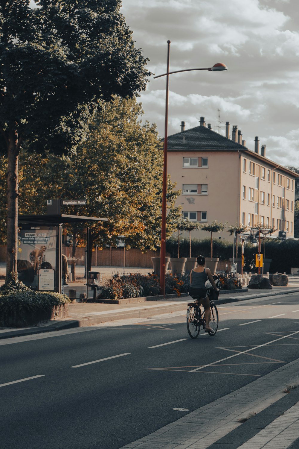 a person riding a bicycle on a street