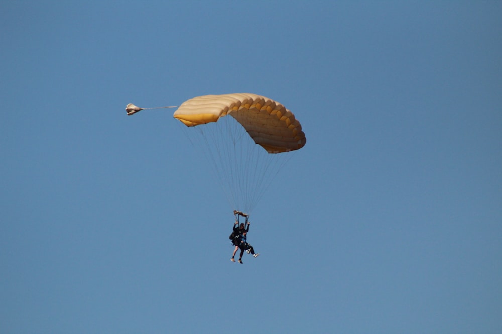 a person parachuting with a parachute