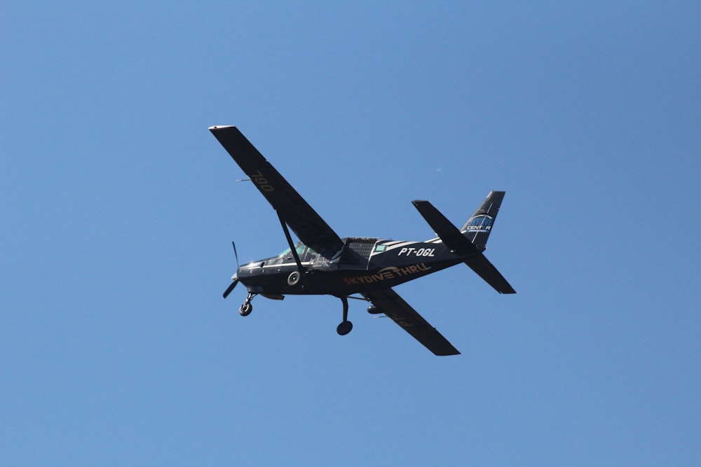 a small airplane flying in the sky