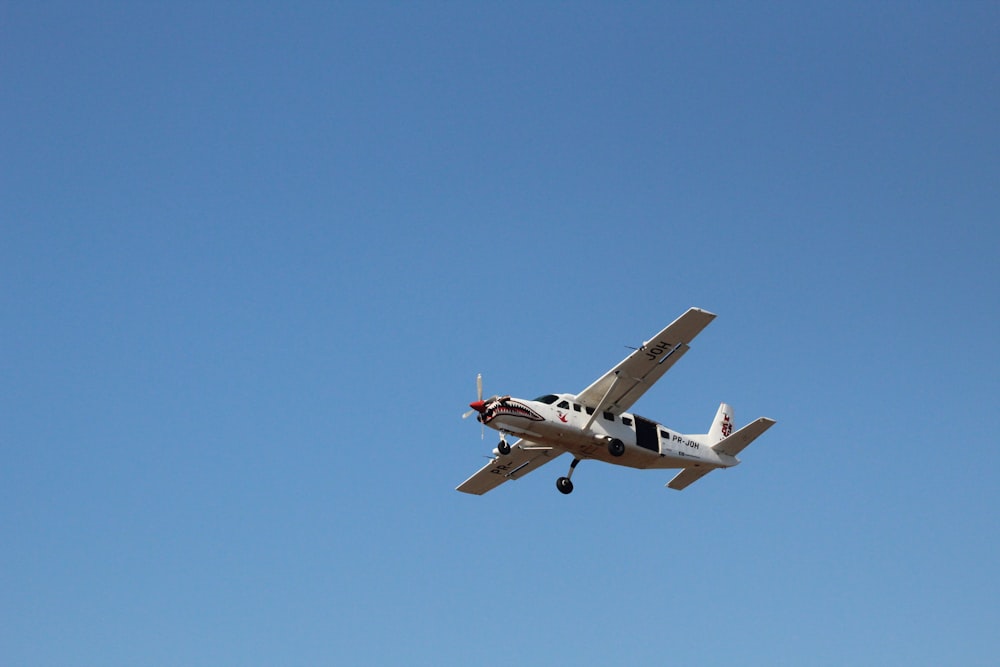 a small airplane flying in the sky