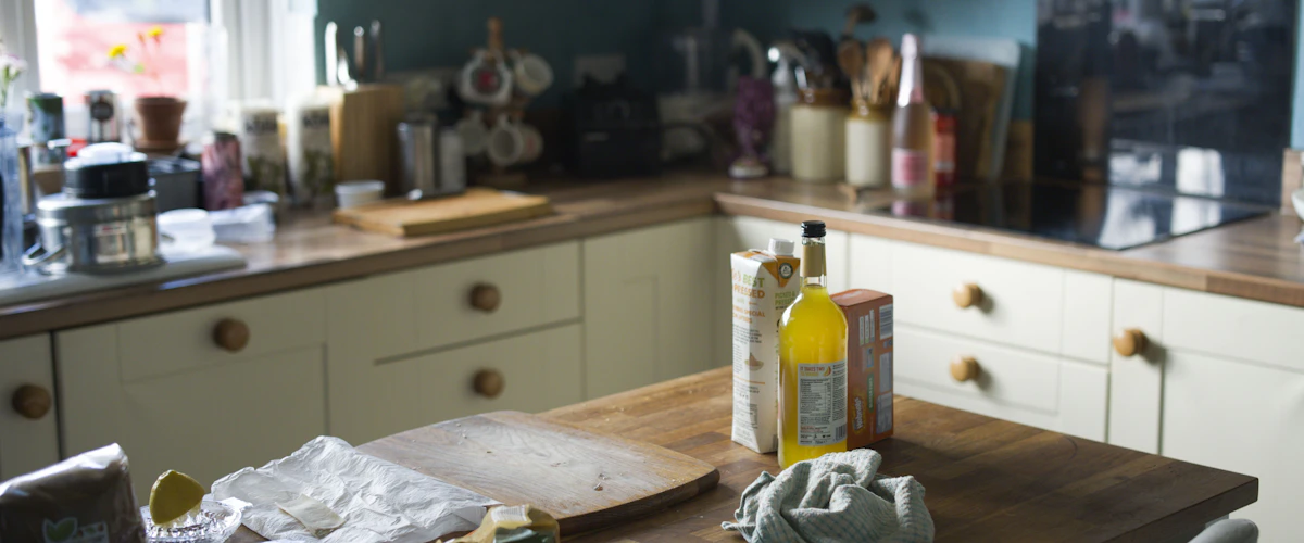 One tray holding oils and essentials on a small kitchen counter