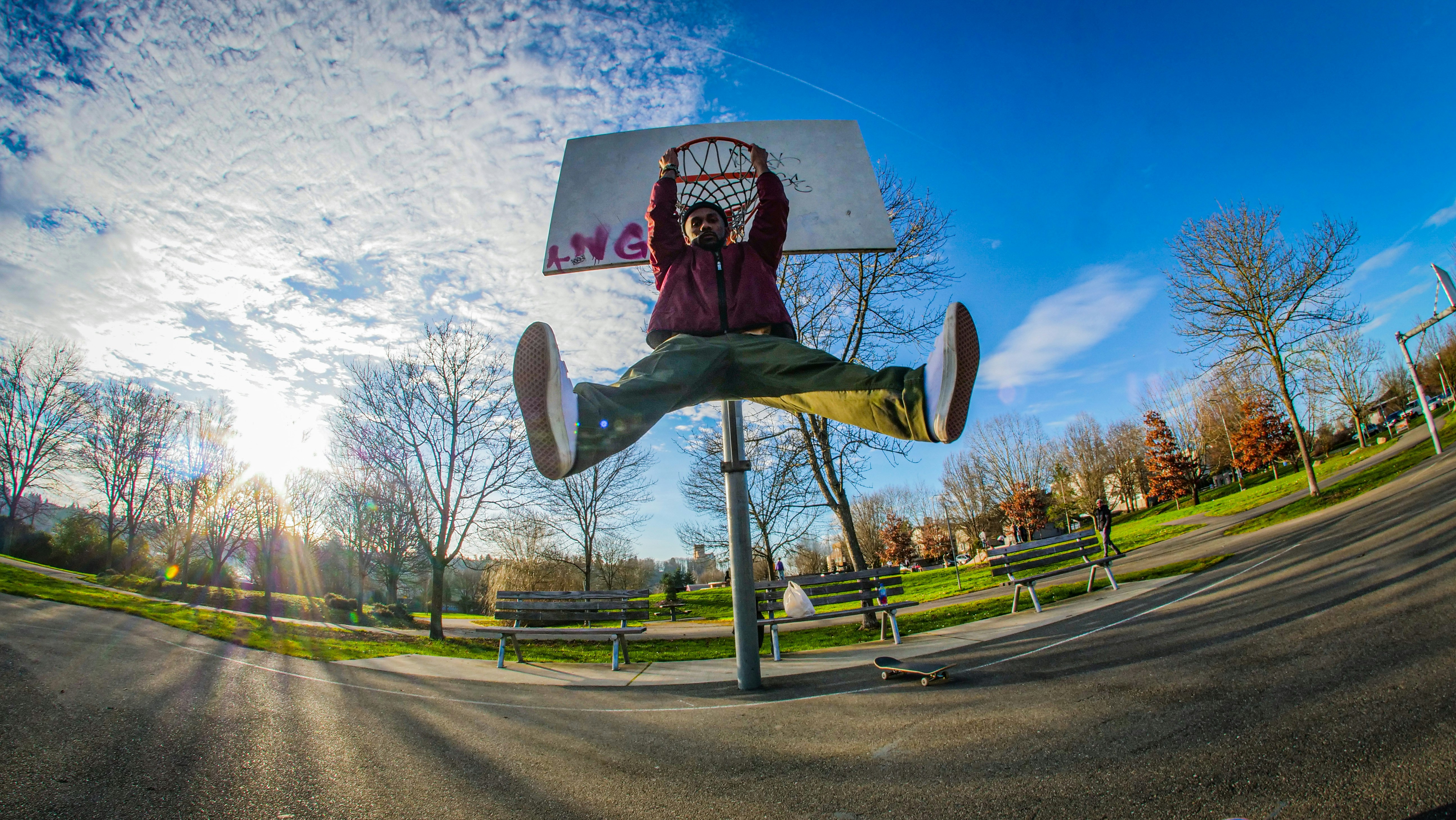 a man riding a skateboard up the side of a road