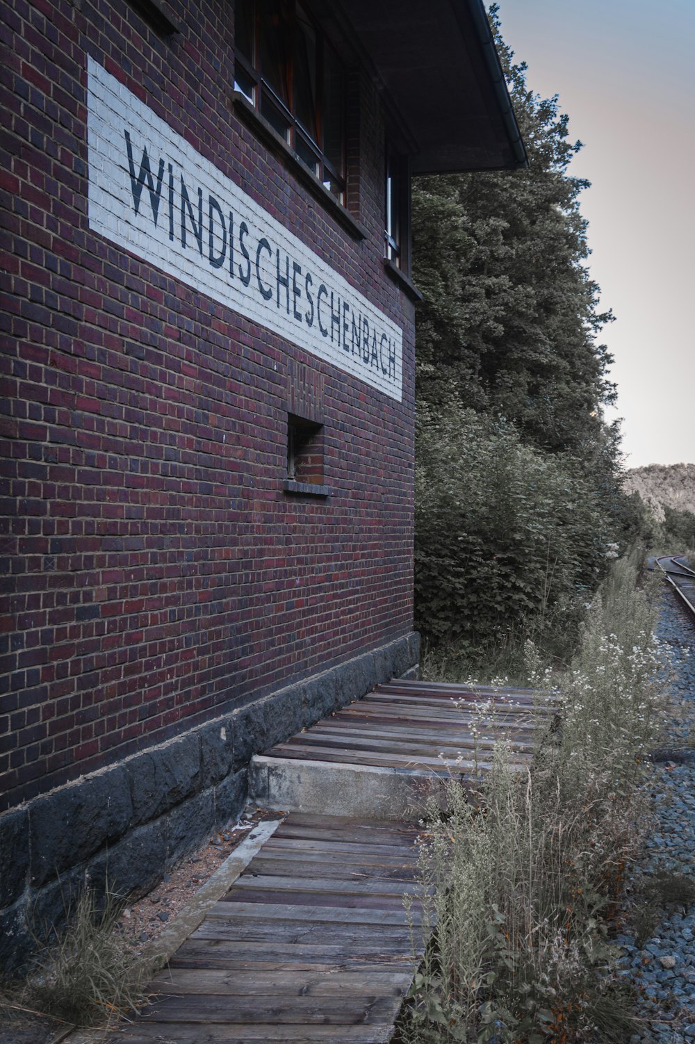 a brick building with a sign on it