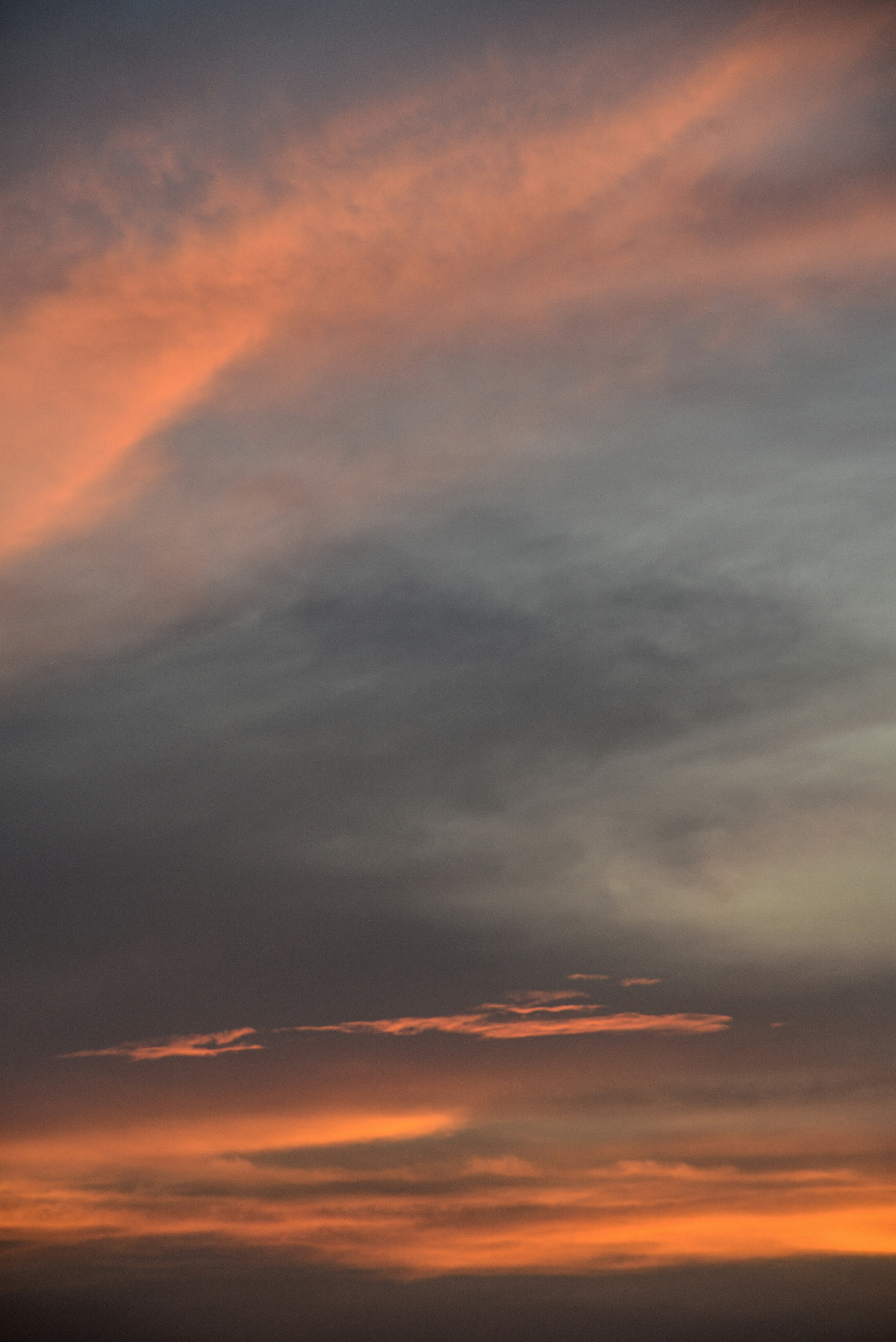 a cloudy sky with a sunset