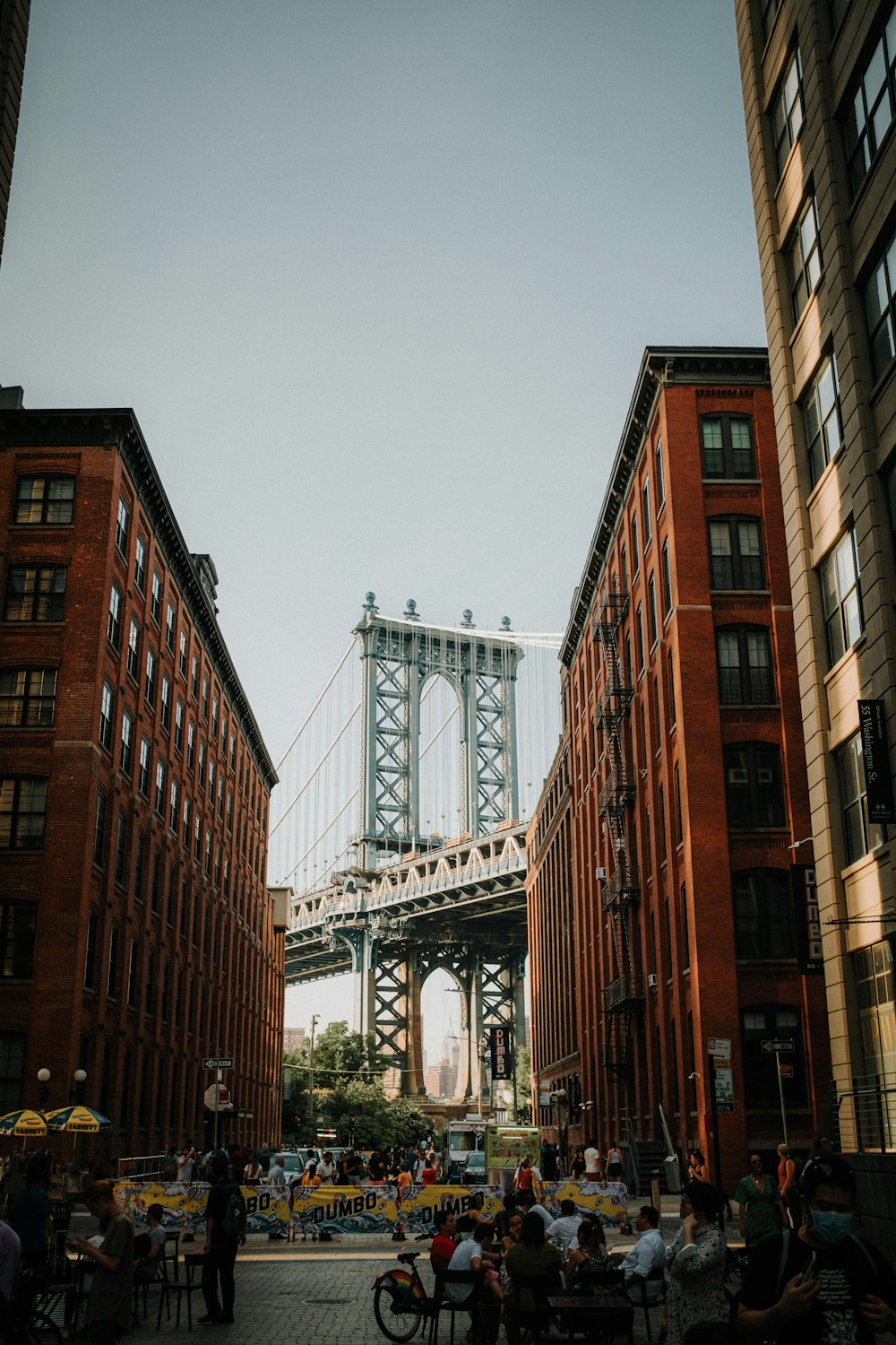 a group of people walking around a city