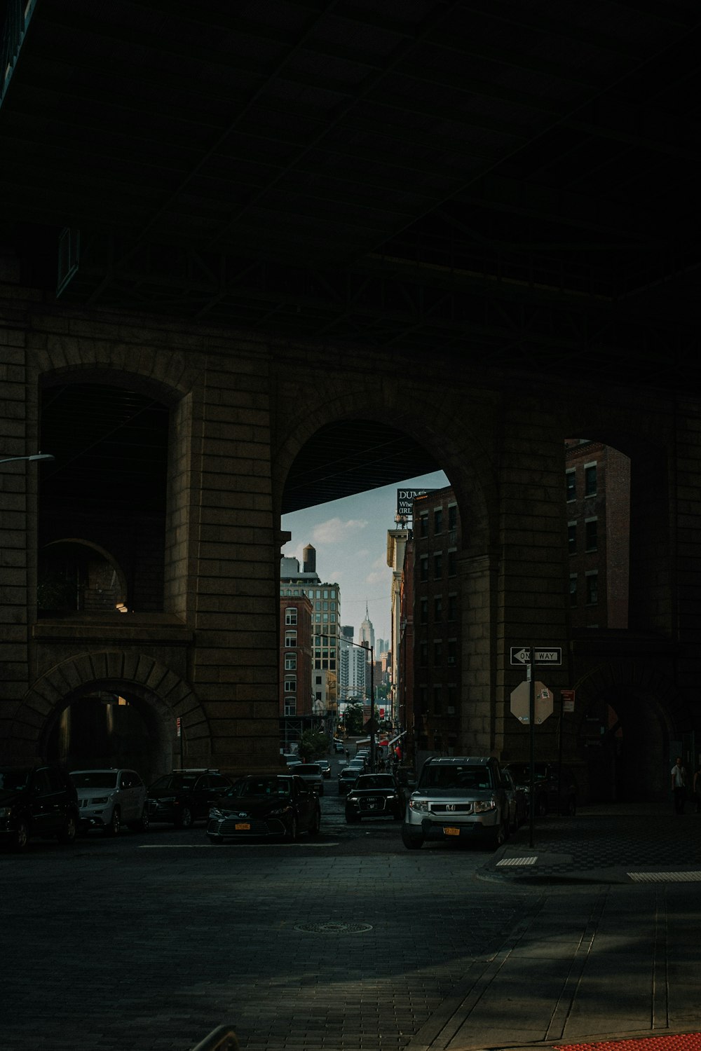 a street with cars and buildings