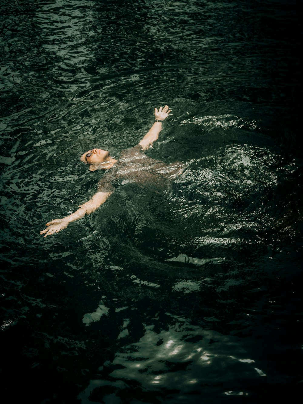 a man swimming in water