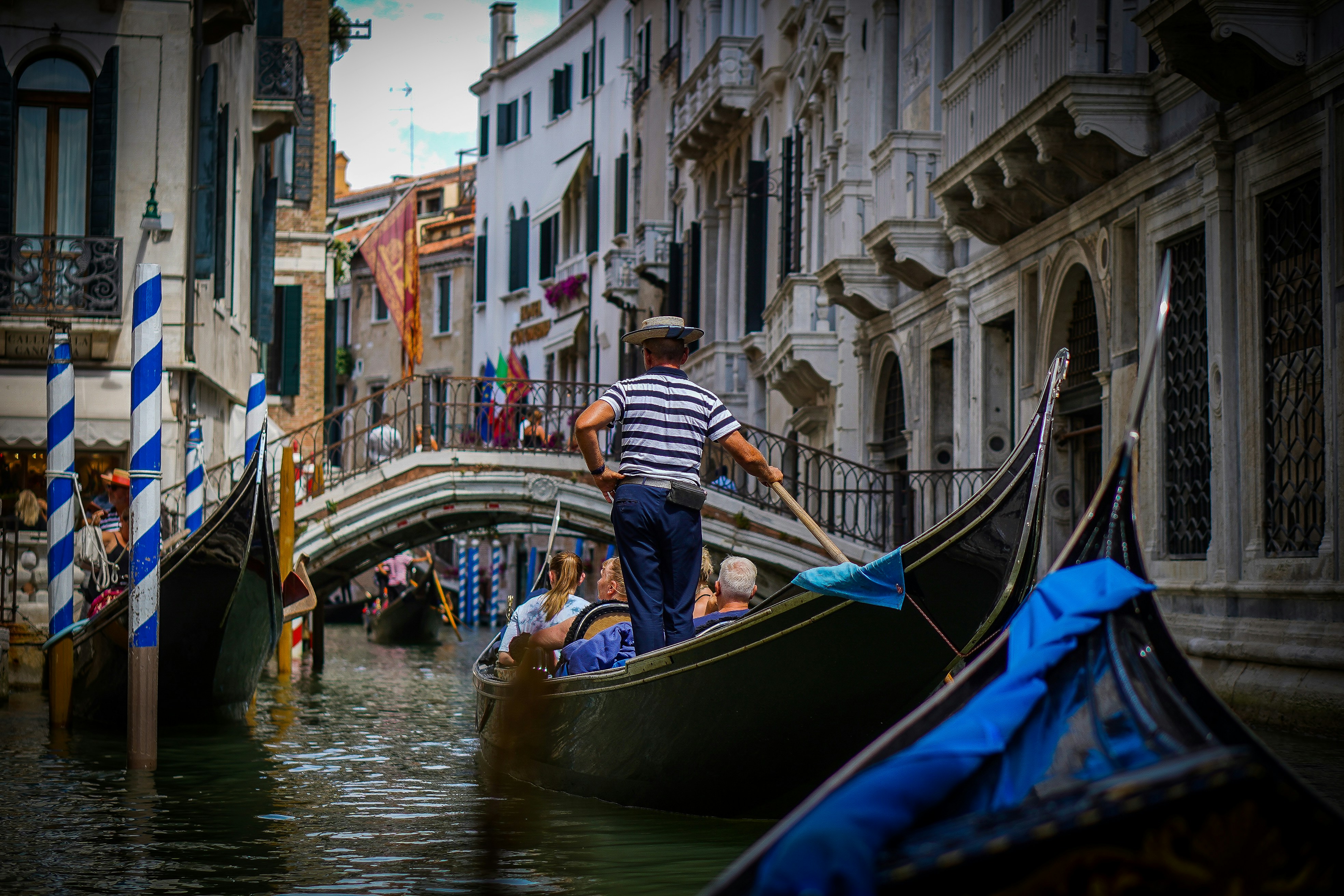 a person on a boat in a canal, 