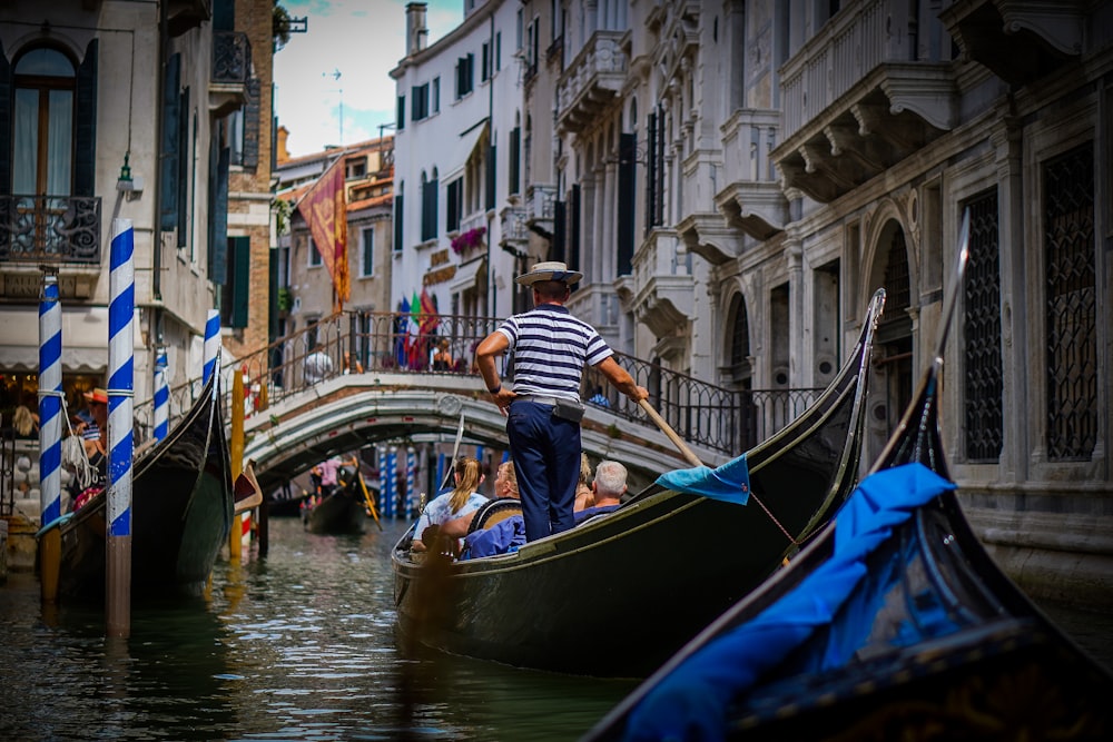 a person on a boat in a canal