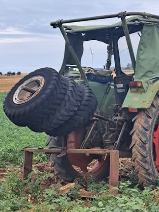 An image of a tractor in a field with replacement parts displayed.