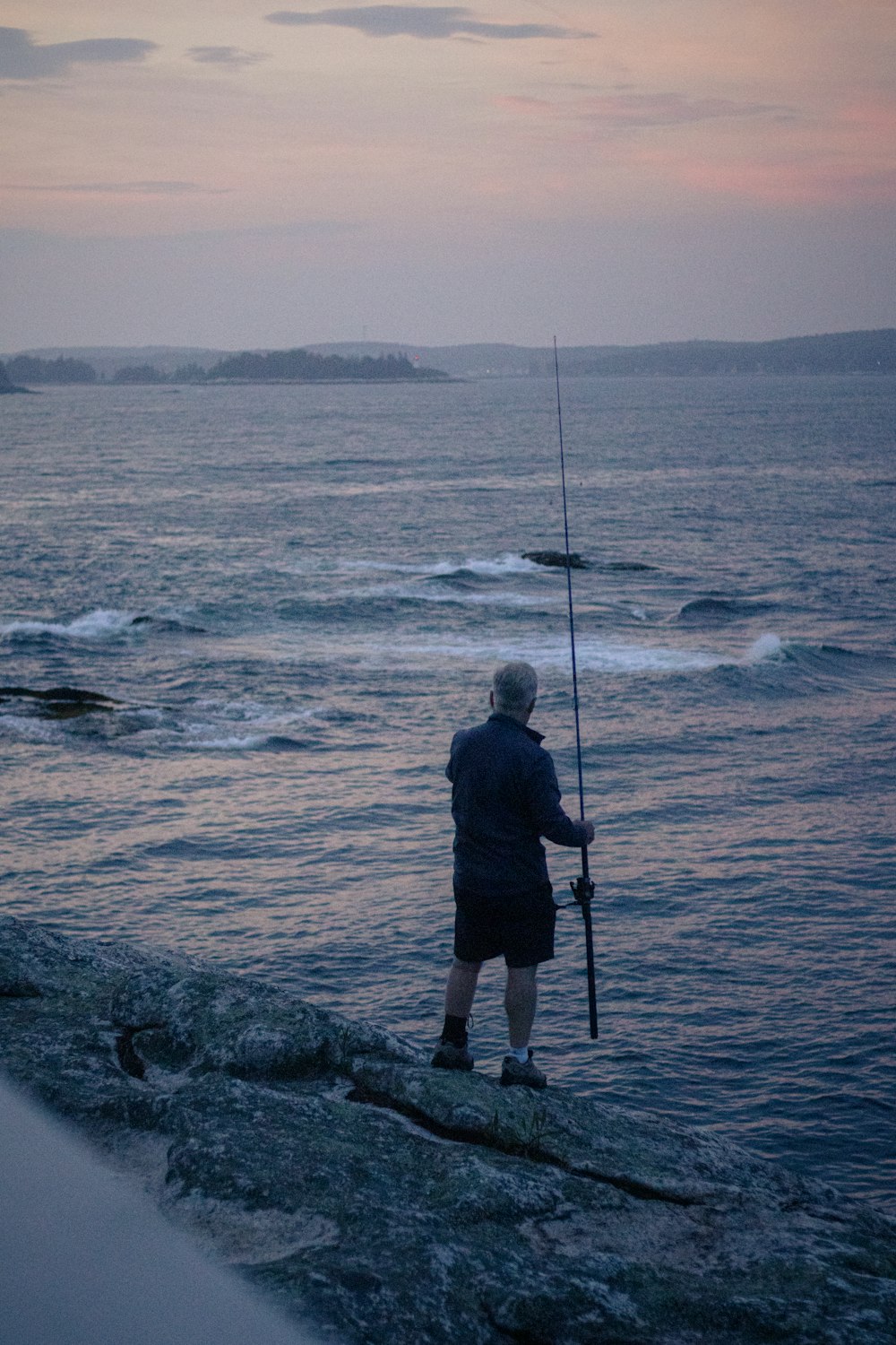 a man fishing in the ocean