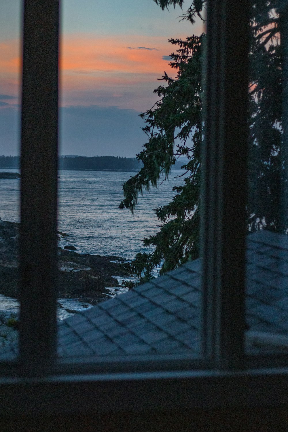 a view of the ocean from a window