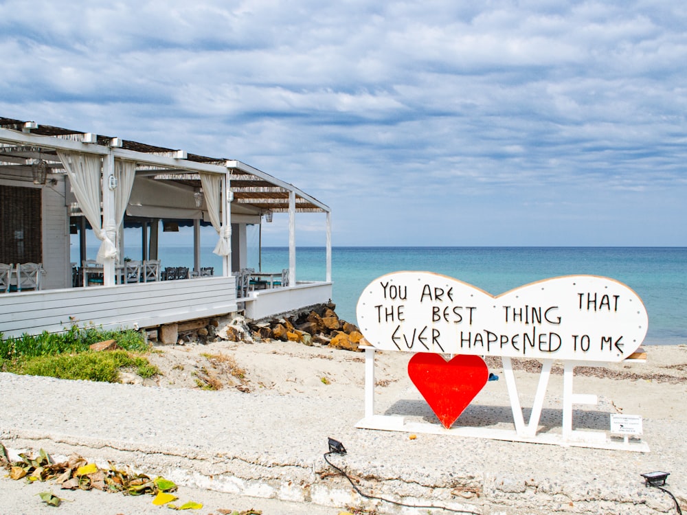 a sign on a beach