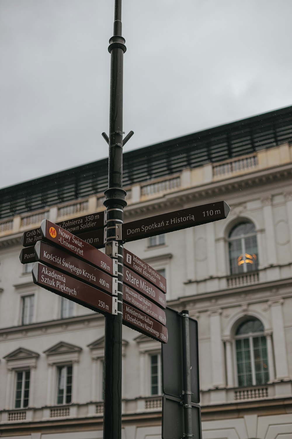 a street sign with several street signs