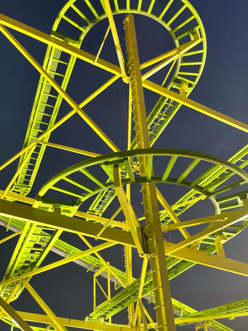 a large green and yellow ferris wheel