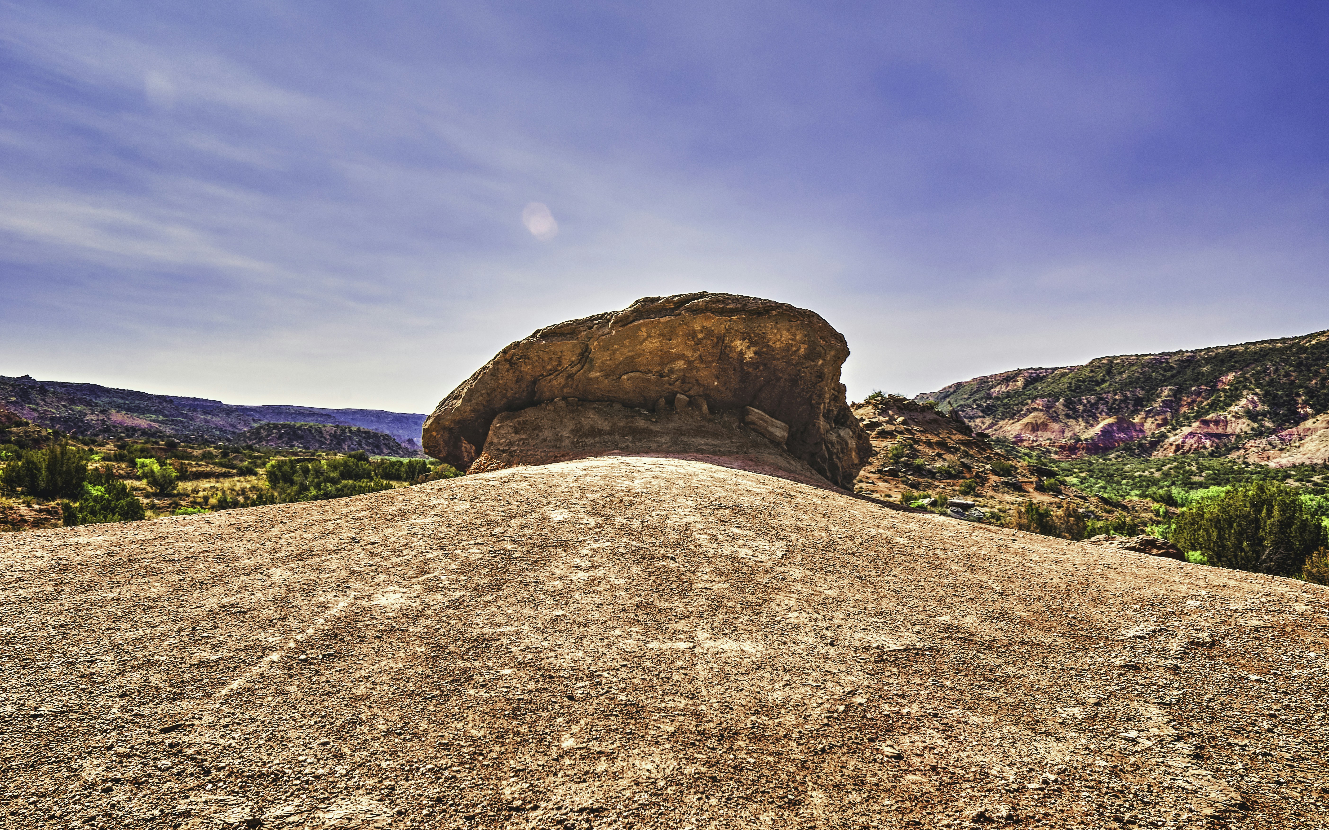 a large rock formation in a desert