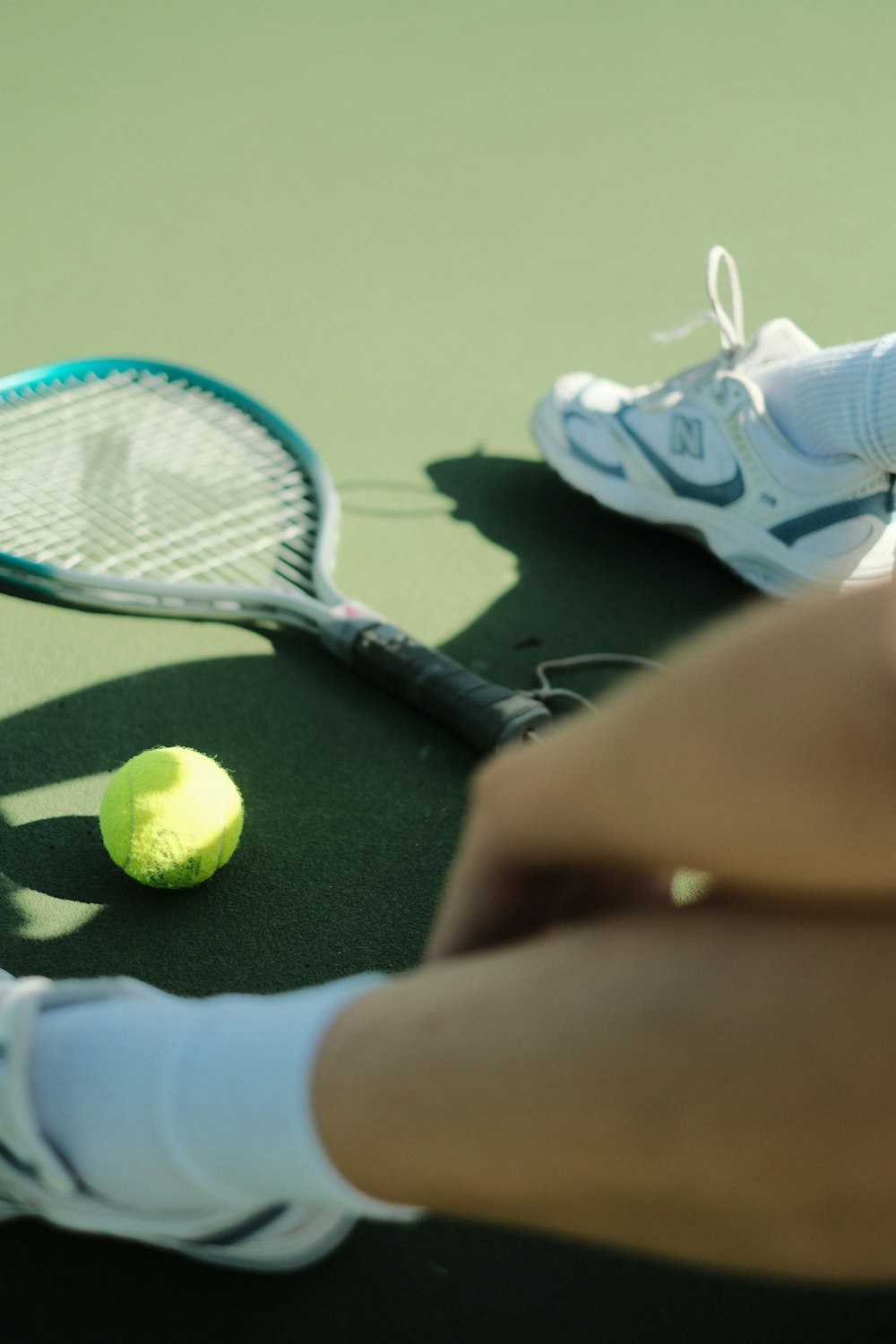 a person hitting a ball with a tennis racket