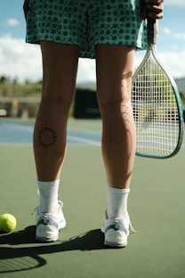 a person holding a tennis racket