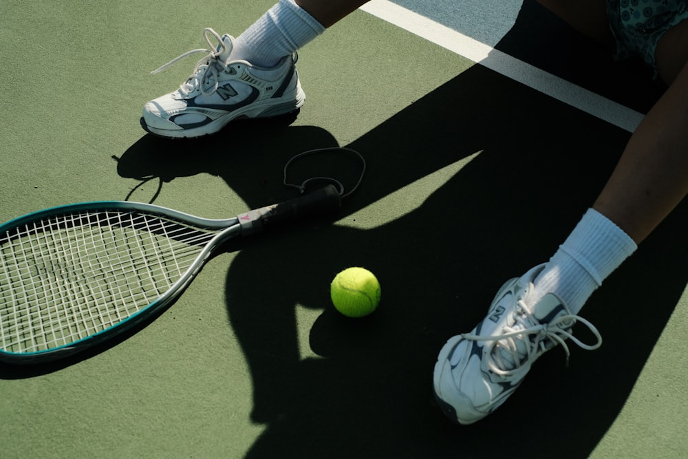 a person swinging a racket at a ball