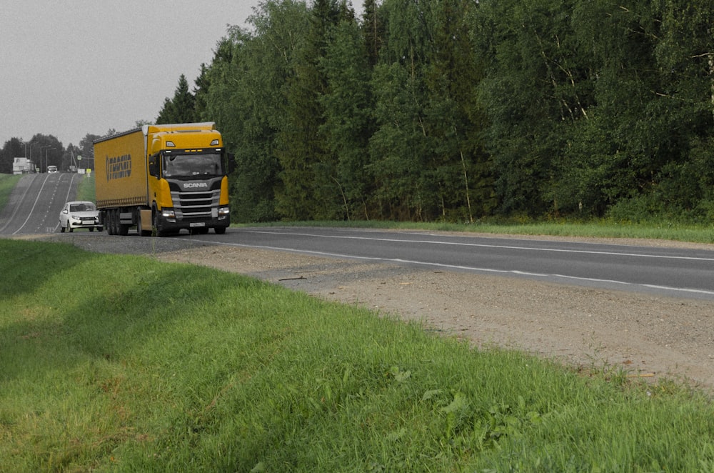 a yellow truck on the road