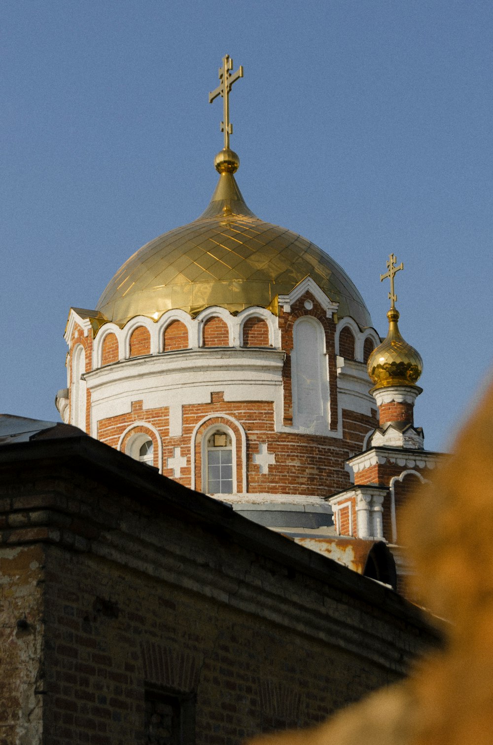 a building with a gold cross on top