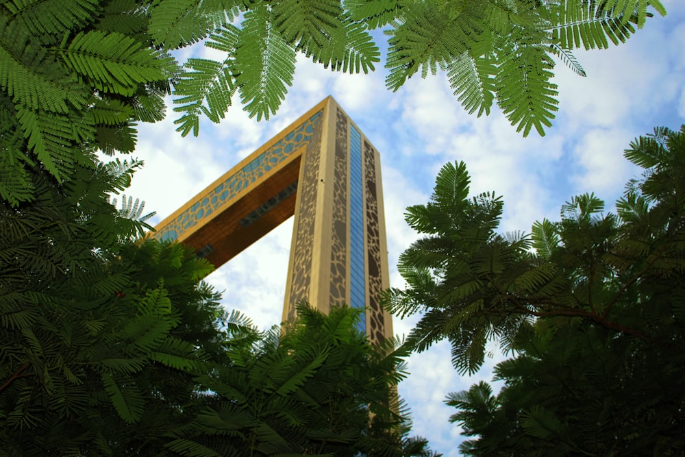 a tall building surrounded by trees