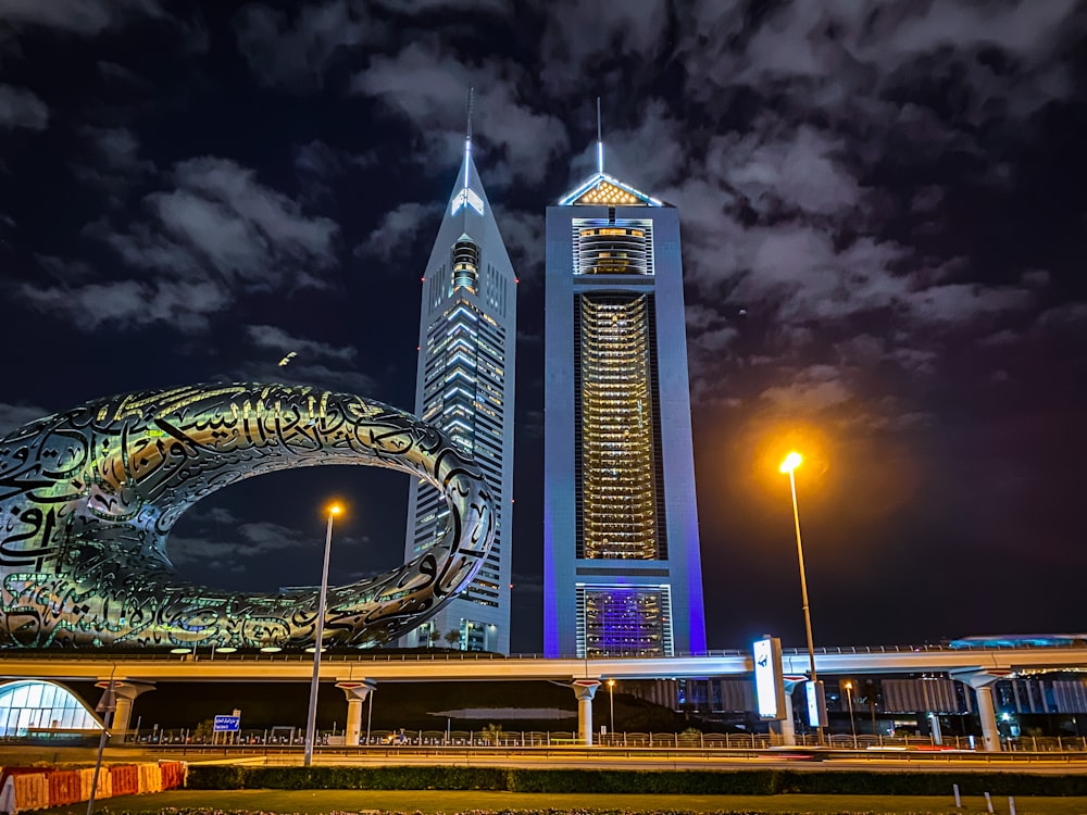 a large building with a ferris wheel in the background