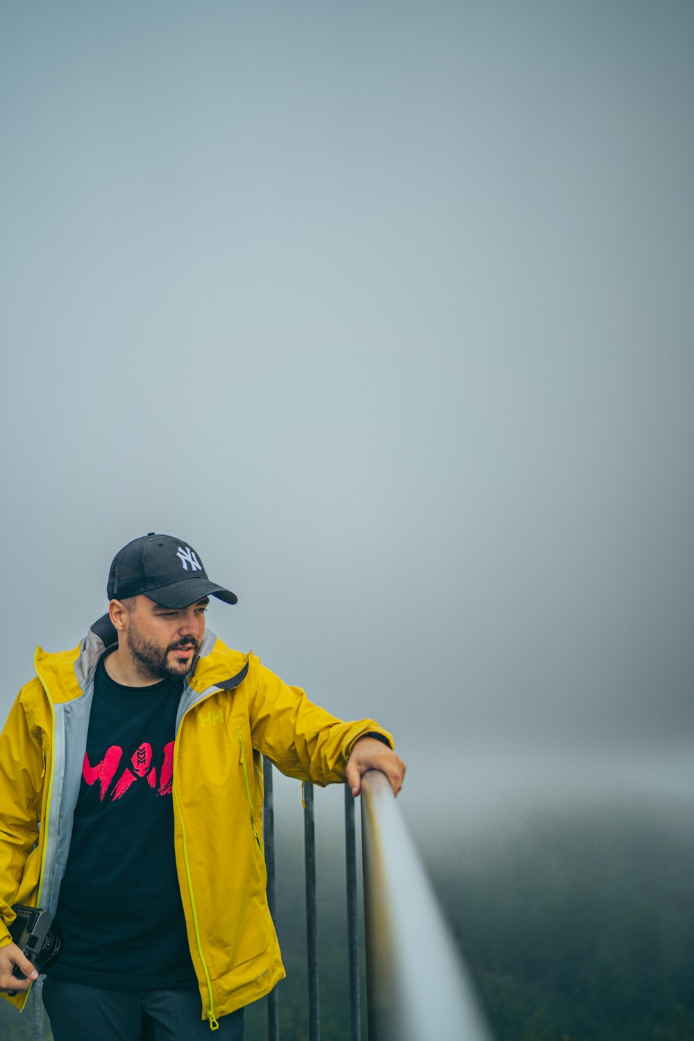 a man standing on a bridge