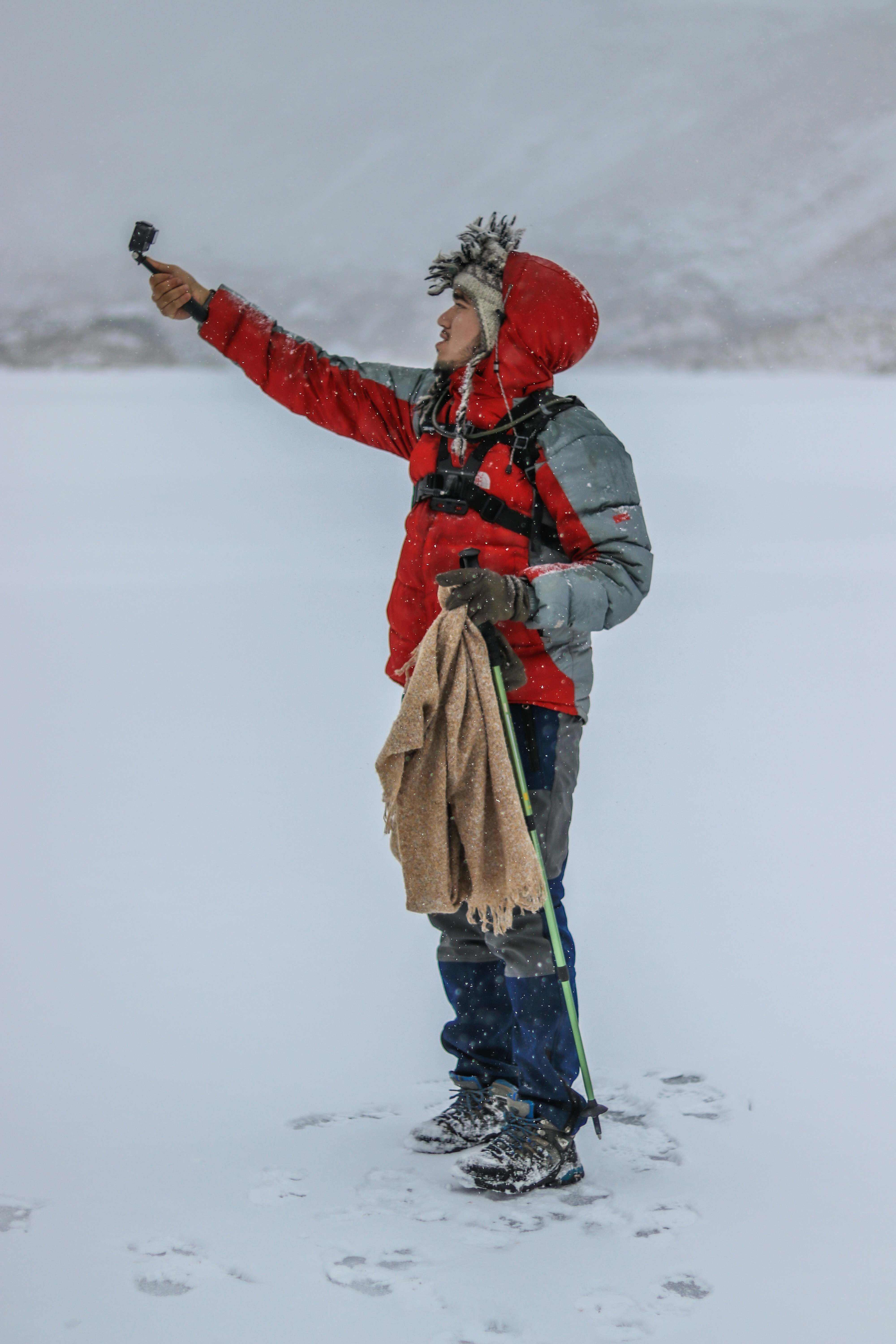 a man holding a snowboard