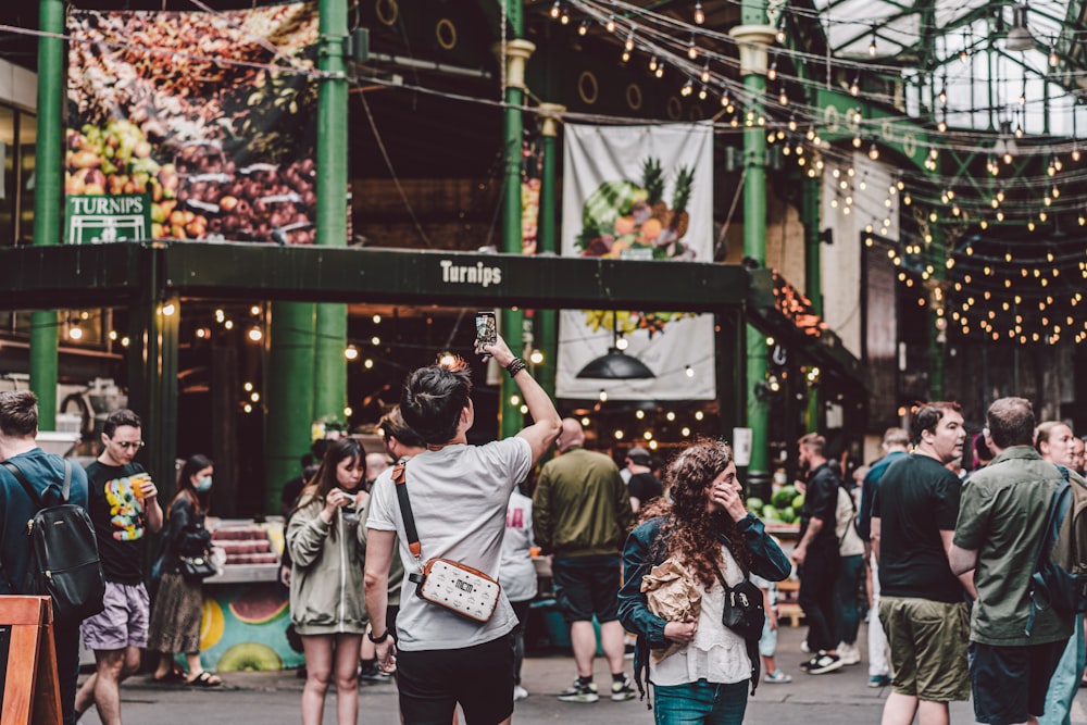 a crowd of people walking on a street