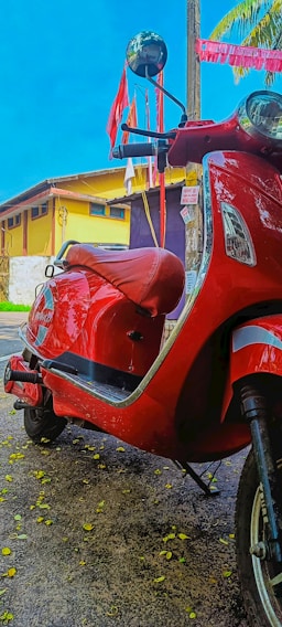 A vibrant image of a scooter parked on a scenic street in Pondicherry.