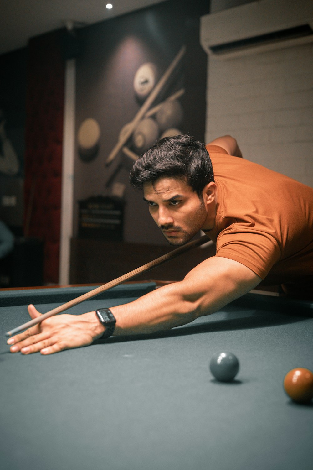 a man playing pool