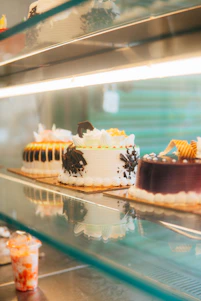 a couple of cakes on a shelf