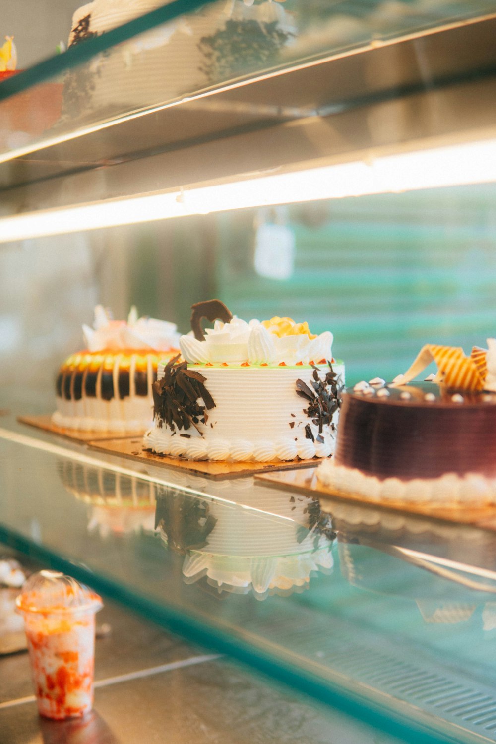 a couple of cakes on a shelf