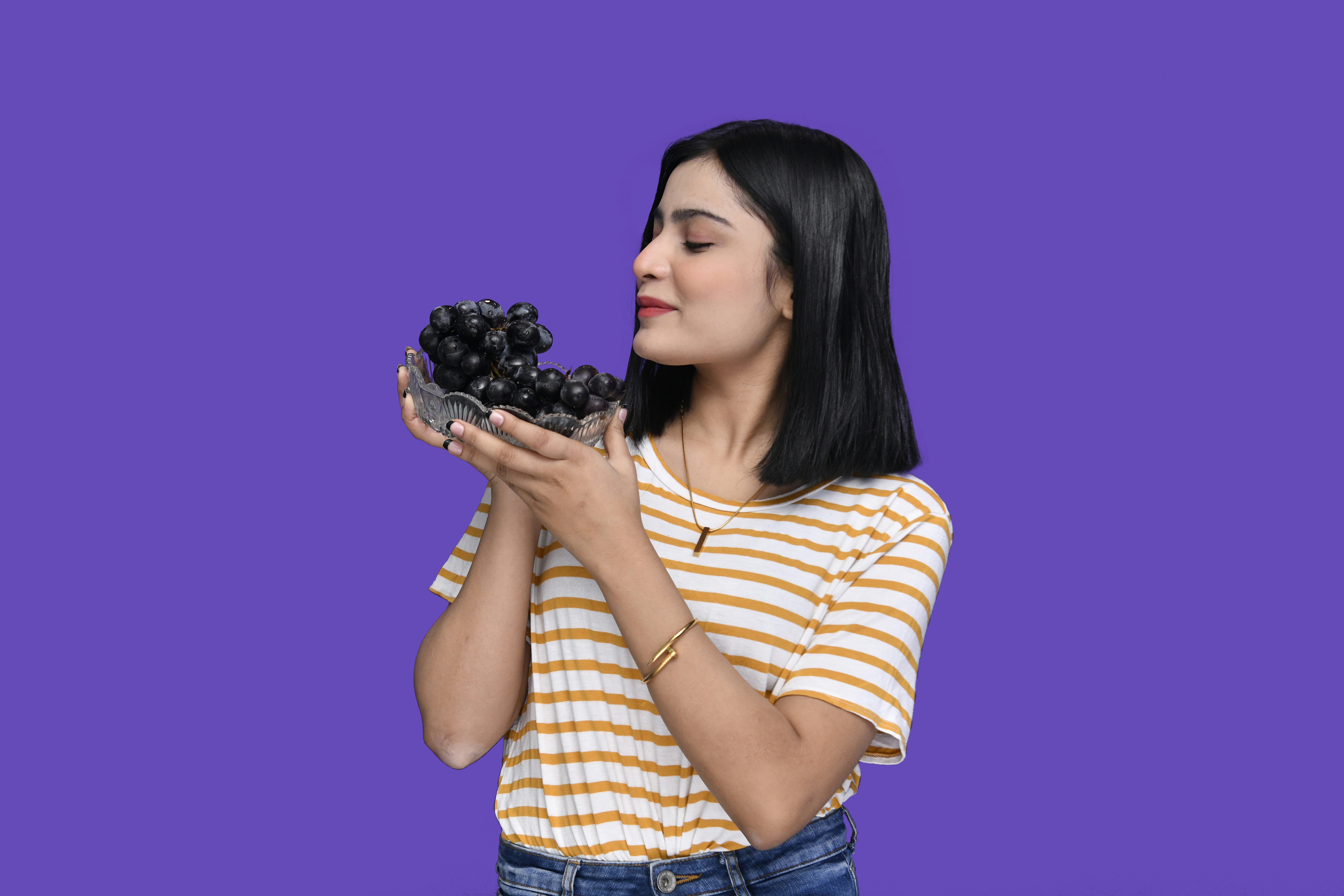 woman eating grapes, healthy lifestyle, skincare