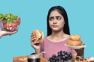 a woman eating a bowl of fruit