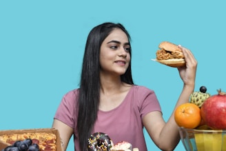 a woman holding a sandwich